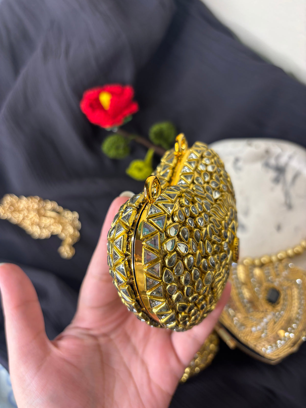 Heart Shaped Kundan Clutch With Maroon Stone