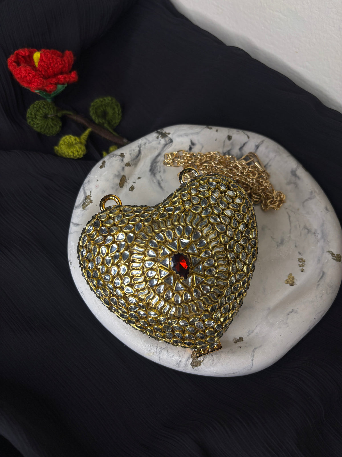 Heart Shaped Kundan Clutch With Maroon Stone