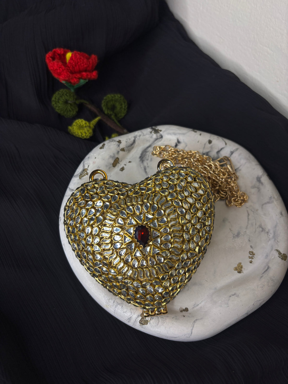 Heart Shaped Kundan Clutch With Maroon Stone
