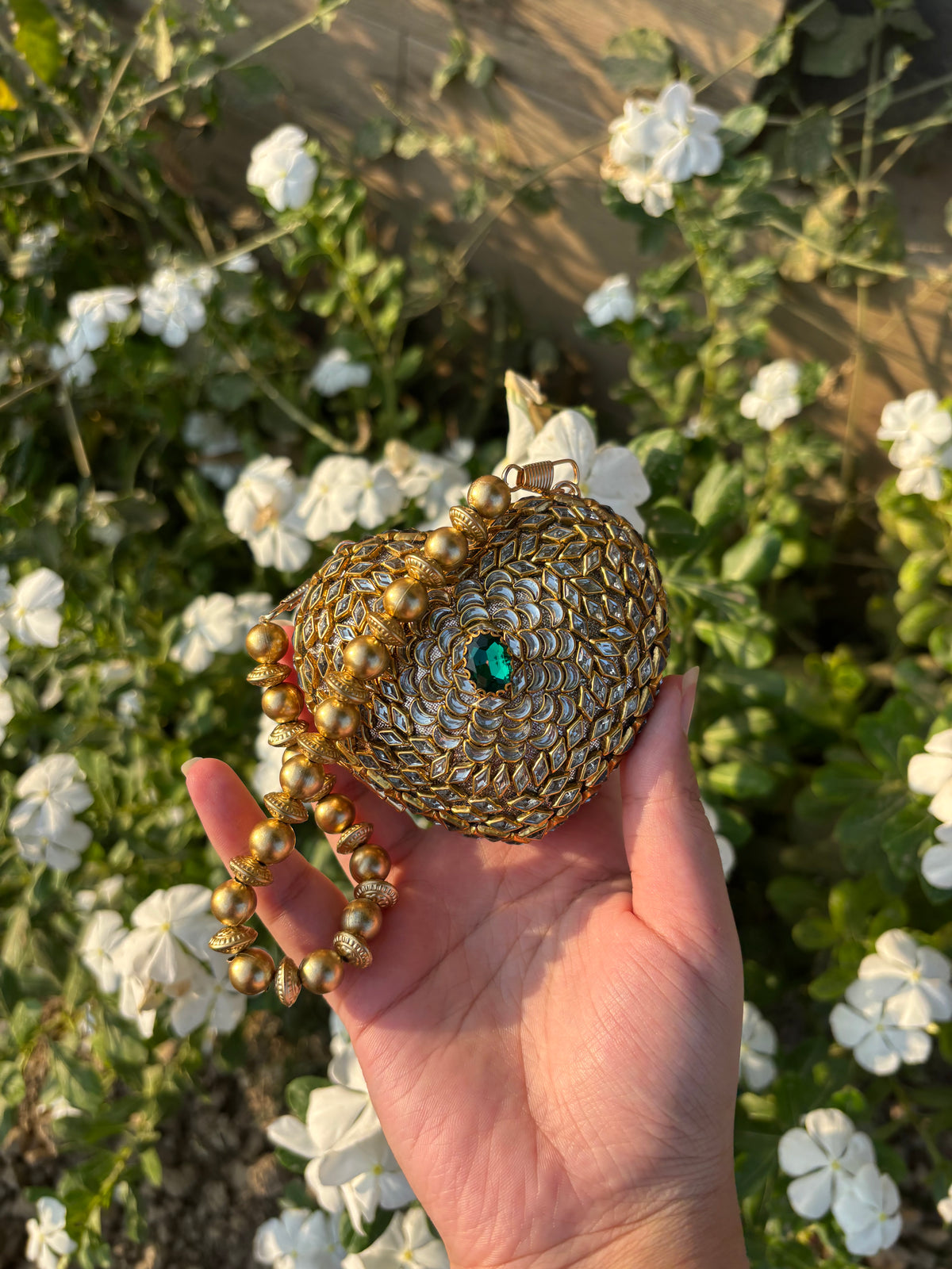 Heart Shaped Kundan Clutch with Green Stone