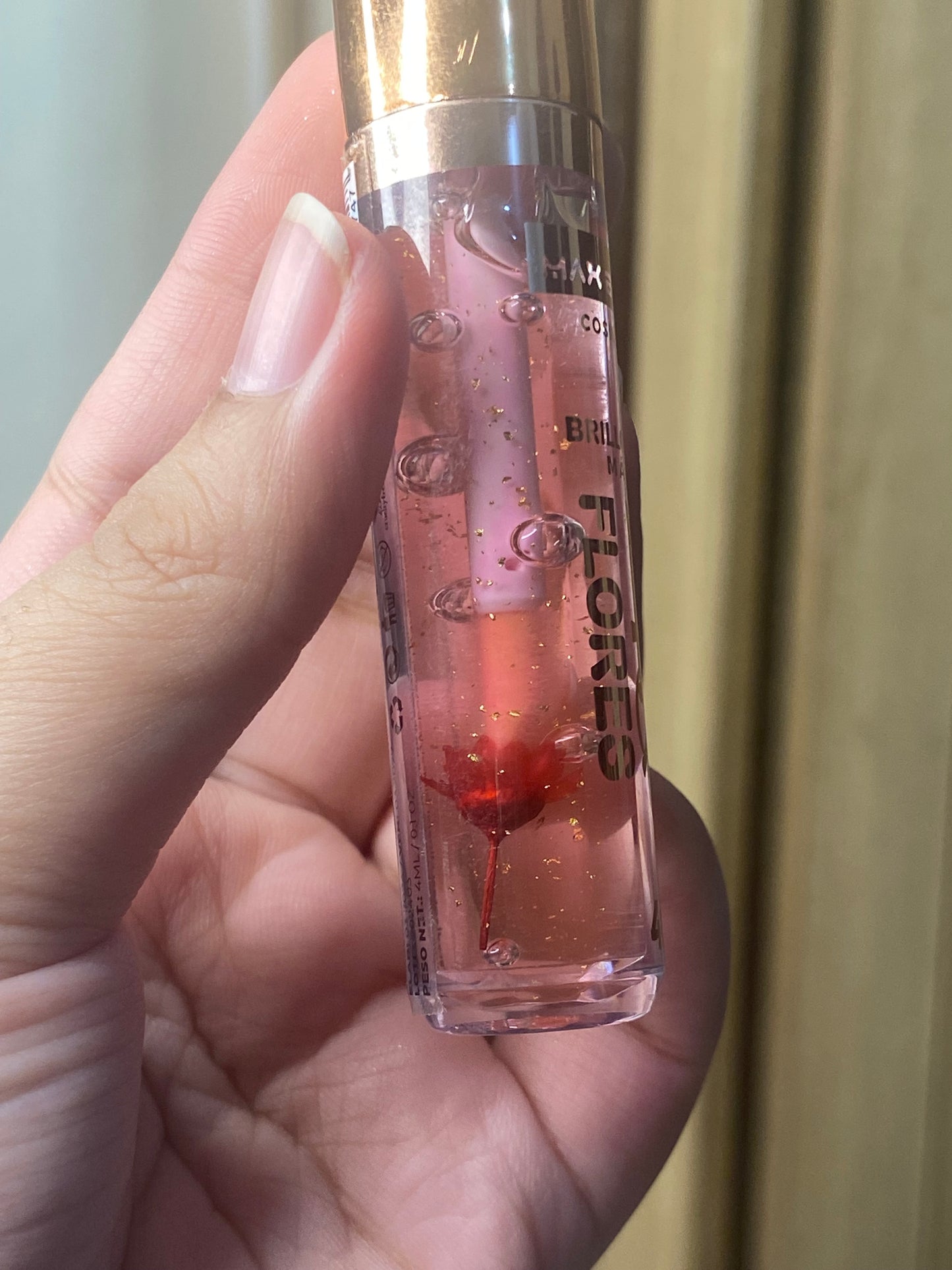MaxBelle 24K Flores Gloss with flower