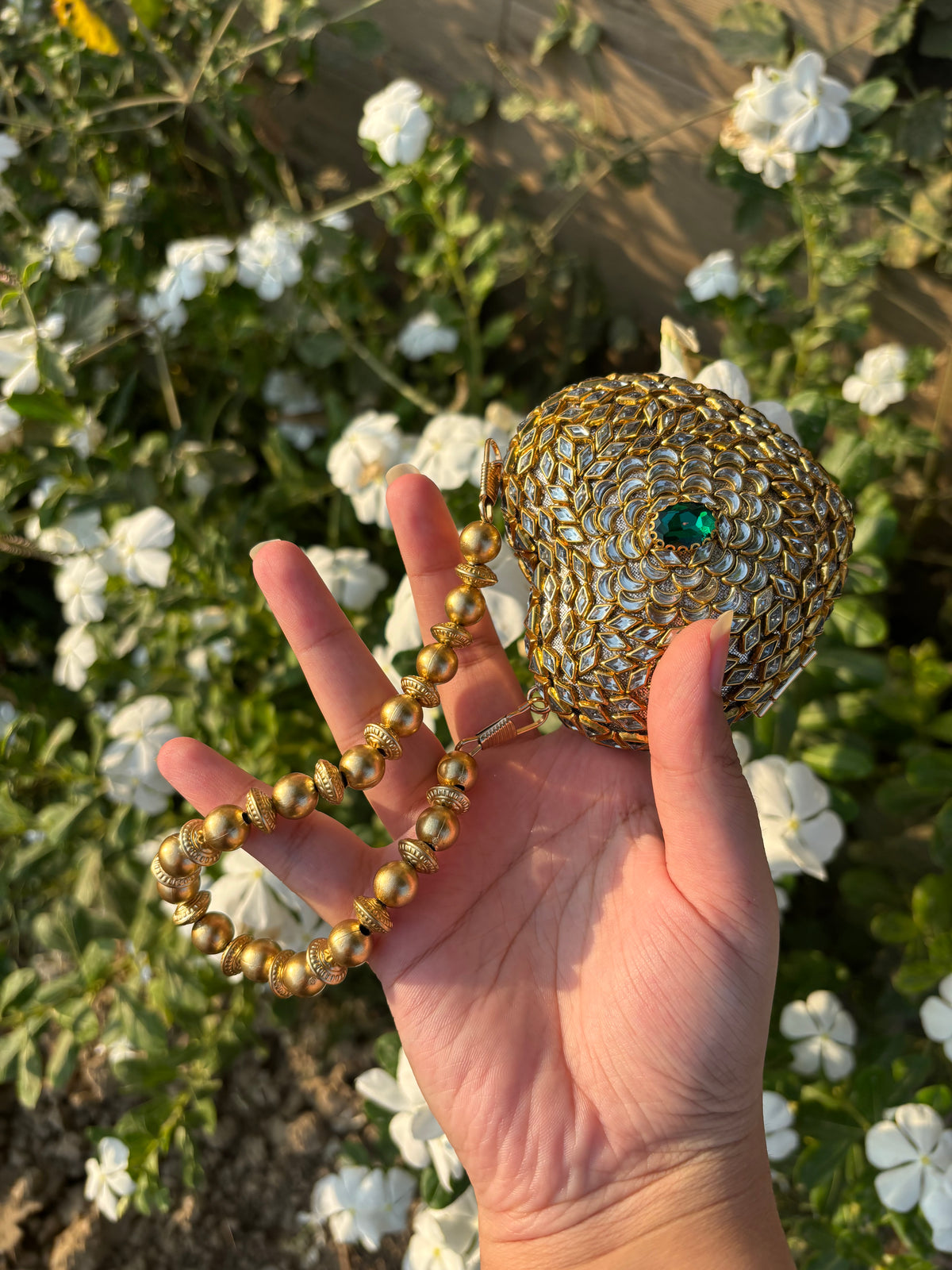 Heart Shaped Kundan Clutch with Green Stone